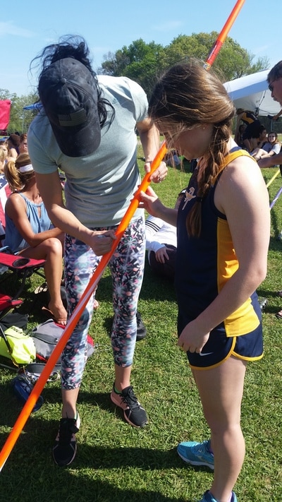 Jenn Suhr autographing Chelsea Chadwick's pole